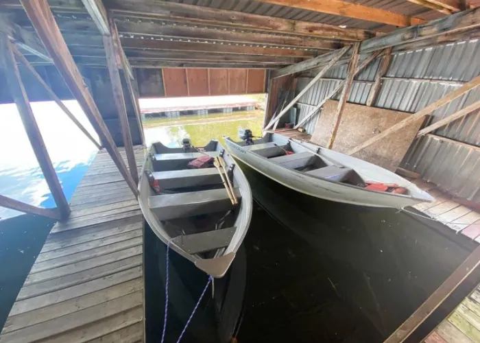 Two fishing boats inside a boat garage