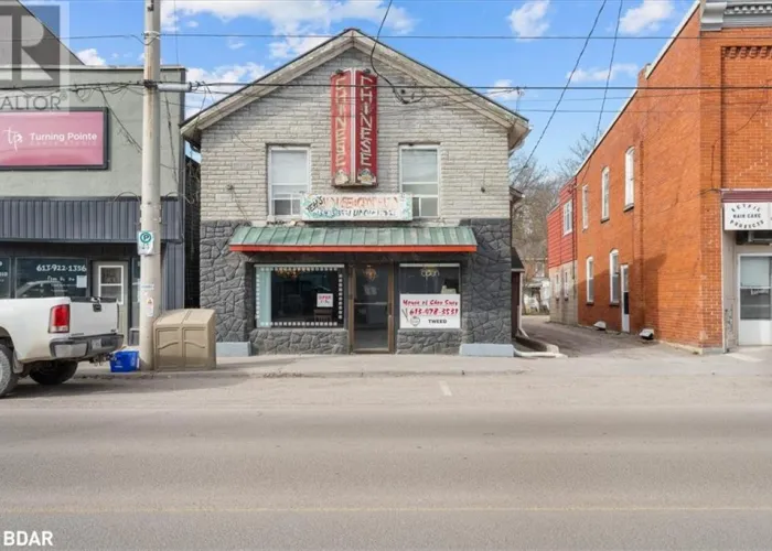 Front facade of a restaurant in downtown Tweed that is for sale