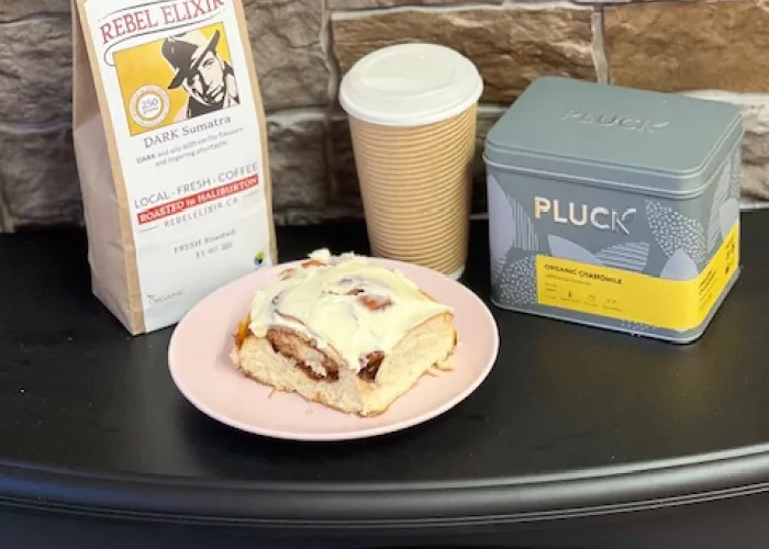 tarts tea and coffee on a table with cinnamon roll