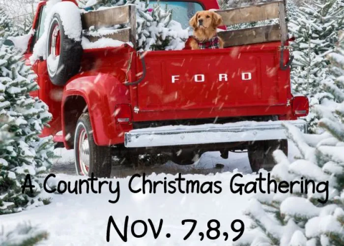 A Country Christmas Gathering Tour Poster. A red truck with a dog and a snow covered tree in the back.