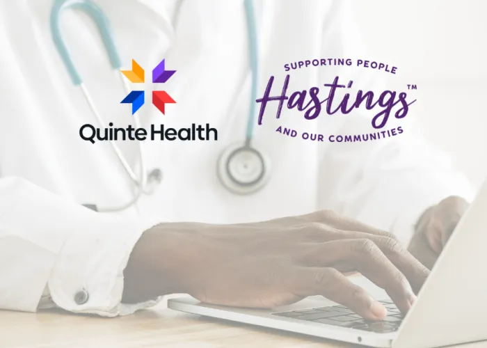 Doctor typing on computer