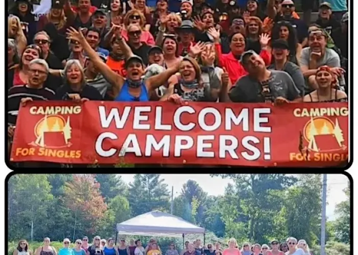 Large group of campers holding a welcome campers banner