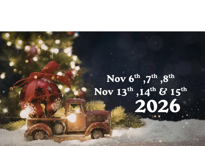 Small ornament of old fashioned truck with holiday lights and red bell and bow in back, lit up christmas tree blurred in background, snow on ground, event dates