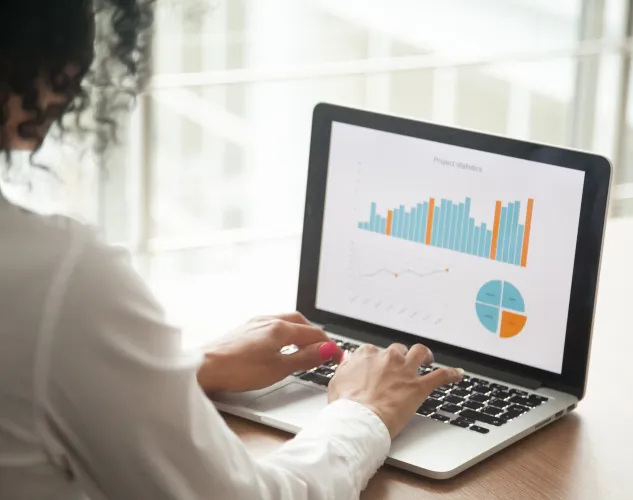 Women looking at charts on computer